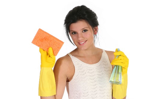 Local window cleaner working on upper-floor windows in Brent